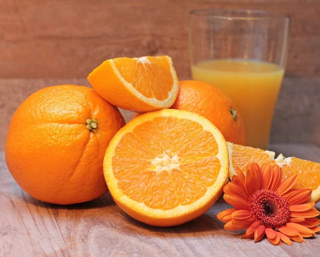 Whole orange and an orange juice