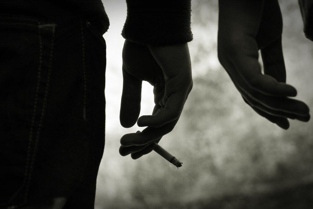 A person holding a cigarette in your hand