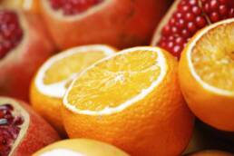Halved oranges and pomegranates