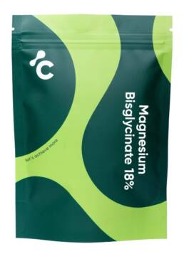 Magnesium bisglycinaat capsules in een groene en limoenverpakking, vooraanzicht, energiesupplement.